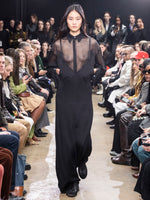 Image of model walking Proenza Schouler Fall Winter 2024 Runway wearing Smithson Top in Organza Knit in black