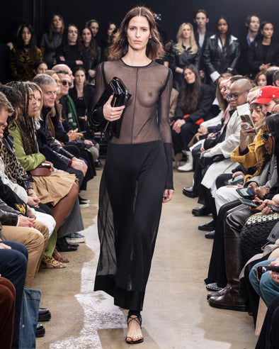 Image of model walking in Proenza Schouler Fall Winter 2024 Runway Show wearing Anneliese Dress in Organza Knit in black
