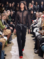 Image of model walking Proenza Schouler Fall Winter 2024 Runway wearing Ryman Jean in black multi