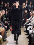 Image of model walking Proenza Schouler Fall Winter 2024 Runway wearing Fiona Coat in Shearling in black