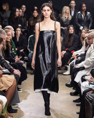 Image of model walking in Proenza Schouler Fall Winter 2024 Runway Show wearing Ivonne Dress in Polished Leather in black