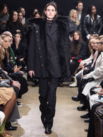 Image of model walking Proenza Schouler Fall Winter 2024 Runway wearing Teddy Pant in Wool Twill Suiting in black