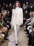 Image of model walking in Proenza Schouler Fall Winter 2024 Runway wearing Archer Jacket in Wool Twill Suiting in wax