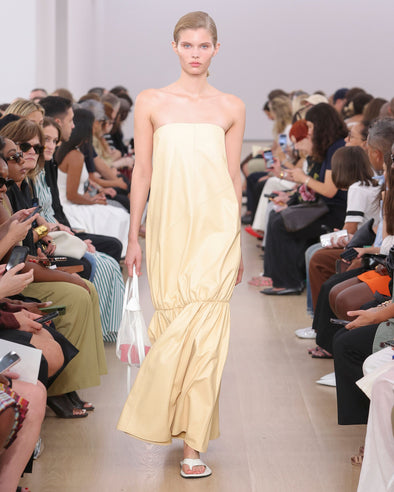 Runway image of model in Margot Dress In Glossy Leather in resin