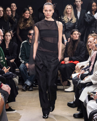 Image of model walking Proenza Schouler Fall Winter 2024 Runway wearing Teddy Pant in Wool Twill Suiting with Organza in black