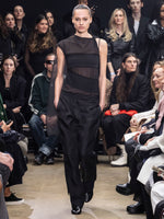 Image of model walking Proenza Schouler Fall Winter 2024 Runway wearing Aurora Top in Chiffon in black