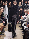 Image of model walking Proenza Schouler Fall Winter 2024 Runway wearing Sandra Turtleneck Sweater in Lofty Eco Cashmere in black