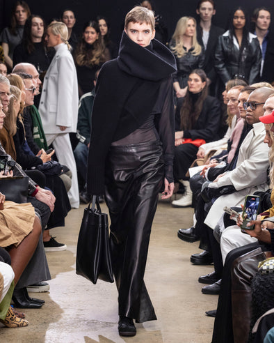 Image of model walking Proenza Schouler Fall Winter 2024 Runway wearing Sandra Turtleneck Sweater in Lofty Eco Cashmere in black