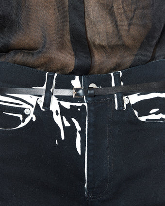 4x5 detailed image of sheer black top and printed Ryman jean with a skinny black belt, Look 14 from FW24 runway