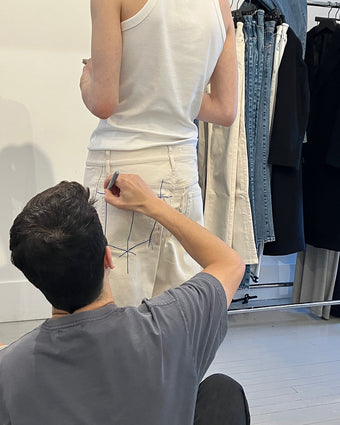 image of Lazaro Hernandez altering Ecru denim