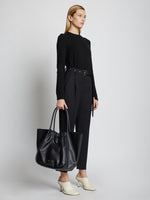 Image of model holding XL Ruched Tote in BLACK