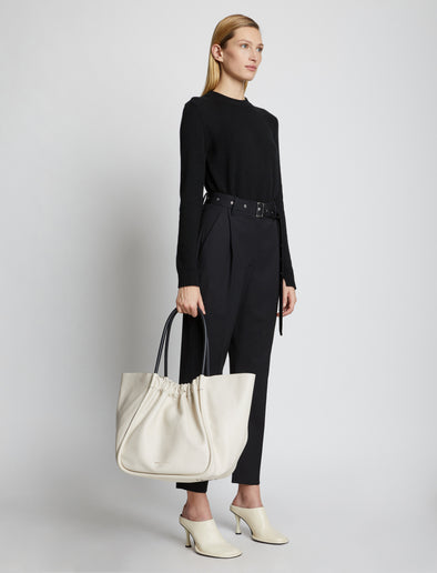 Image of model holding XL Ruched Tote in CLAY