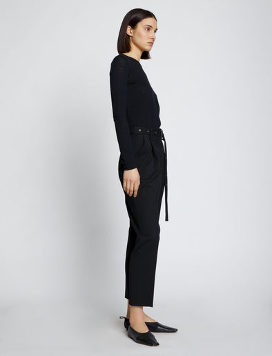 Side full length image of model wearing Solid Tissue Jersey Long Sleeve Tee in Black