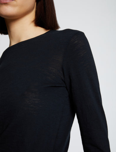 Detail image of model wearing Solid Tissue Jersey Long Sleeve Tee in Black