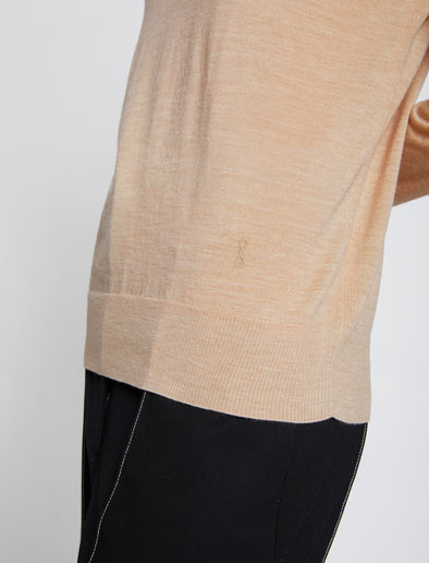 Detail image of model wearing Eco Superfine Merino Sweater in BEIGE