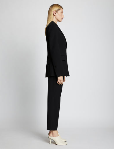 Side full length image of model wearing Upcycled Wool Blazer in BLACK