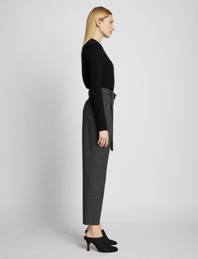 Side full length image of model wearing Upcycled Wool Carrot Pants in CHARCOAL