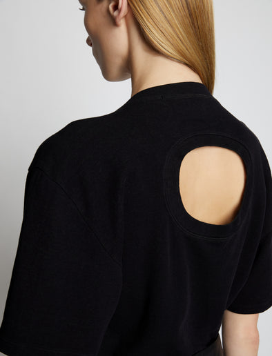 Detail image of model wearing Eco Cotton T-Shirt in BLACK