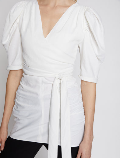 Detail image of model wearing Linen Viscose Shirred Sleeve Top in OFF WHITE