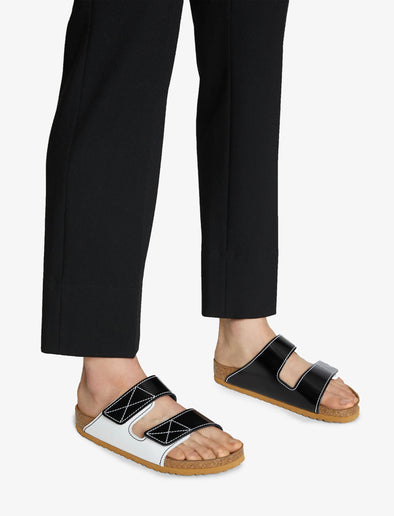 Proenza Schouler image of model wearing Arizona PS EXQ Berlin Birkenstock collaboration in White/Black