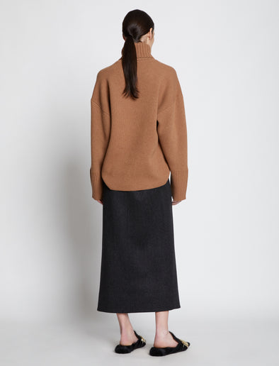 Back full length image of model wearing Doubleface Eco Cashmere Oversized Turtleneck Sweater in SADDLE