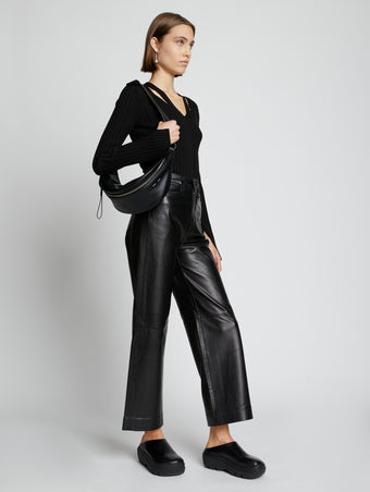 Image of model wearing Stanton Leather Sling Bag in BLACK
