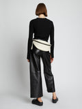 Image of model wearing Stanton Leather Sling Bag in vanilla
