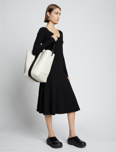 Image of model carrying Sullivan Leather Bag in VANILLA on shoulder