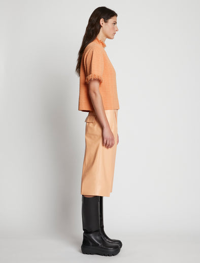 Side full length image of model wearing Viscose Jacquard Top in CORAL
