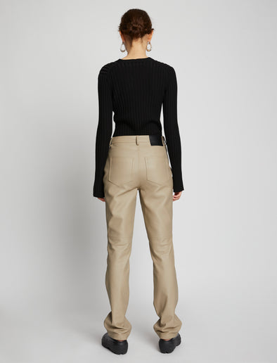 Back full length image of model wearing Leather Straight Pants in TAUPE