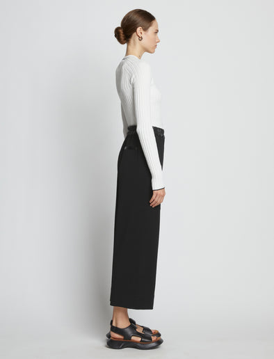 Side full length image of model wearing Crepe Wide Leg Pants in BLACK