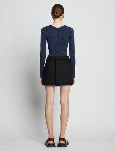 Back full length image of model wearing Melange Rib V-Neck Top in BLUE/BLACK