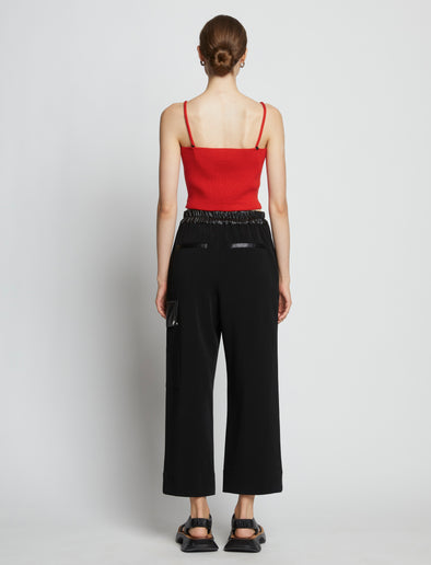 Back full length image of model wearing Cotton Cashmere Tank Top in POPPY