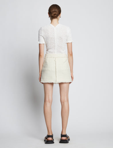 Back full length image of model wearing Tweed Mini Skirt in OFF WHITE