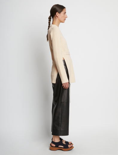 Side full length image of model wearing Compact Boucle Tie Sweater in ECRU