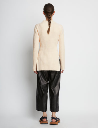 Back full length image of model wearing Compact Boucle Tie Sweater in ECRU