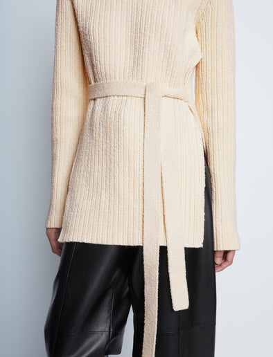 Detail image of model wearing Compact Boucle Tie Sweater in ECRU