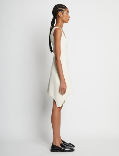 Side full length image of model wearing Compact Viscose Knit Sculpted Dress in ECRU