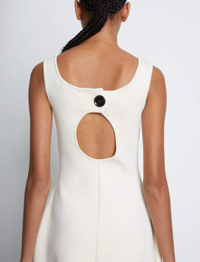 Detail image of model wearing Compact Viscose Knit Sculpted Dress in ECRU