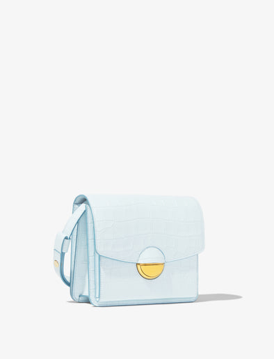Front 3/4 image of Embossed Croc Dia Day Bag in pale blue