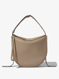 Front image of Baxter Leather Bag in CLAY with straps hanging