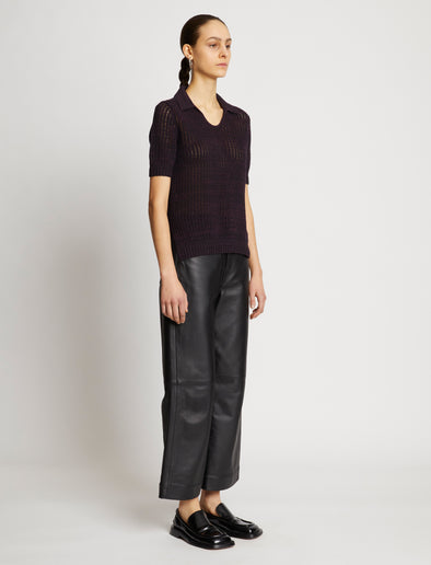 Side full length image of model wearing Cotton Silk Pique Polo Top in BLACK/PLUM