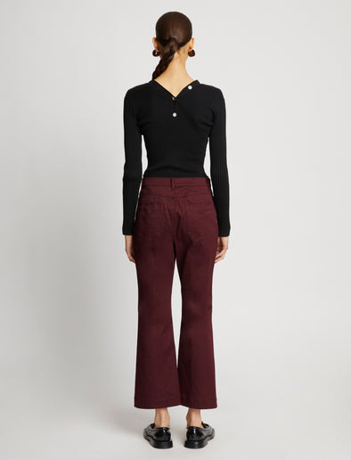 Back full length image of model wearing Cotton Twill Cropped Pants in PLUM