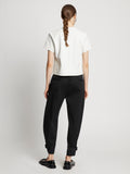 Back full length image of model wearing Cotton Twill Tapered Pants in BLACK
