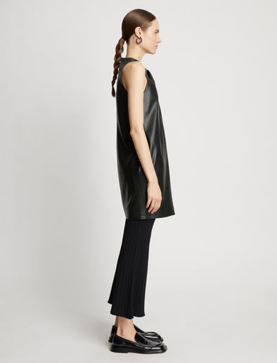 Side full length image of model wearing Faux Leather Sleeveless Dress in BLACK