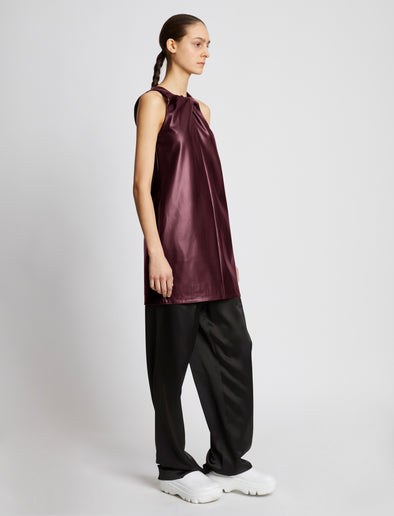 Side full length image of model wearing Faux Leather Sleeveless Dress in PLUM