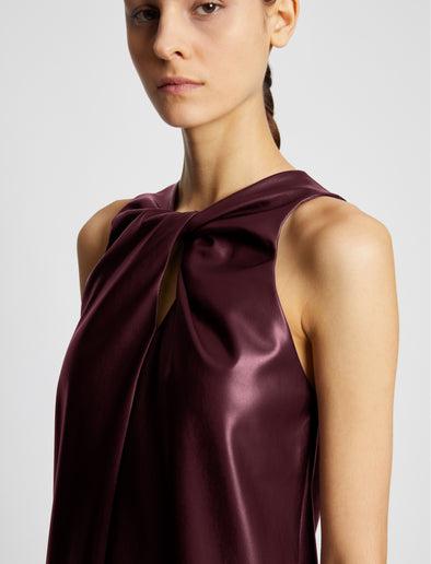 Detail image of model wearing Faux Leather Sleeveless Dress in PLUM