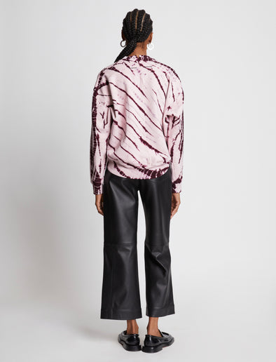 Back full length image of model wearing Tie Dye Sweatshirt in LIGHT PINK/PLUM