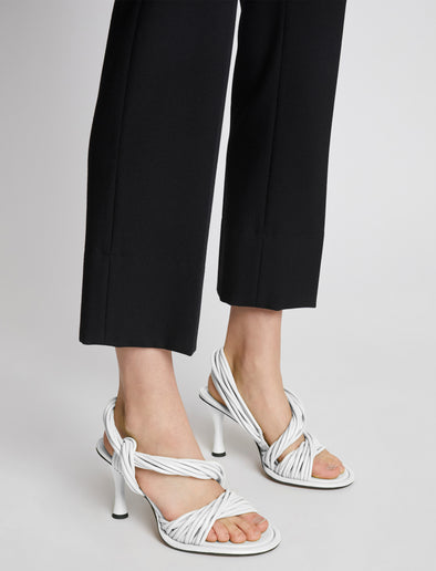 Front image of model wearing Pipe Slide Sandals in WHITE