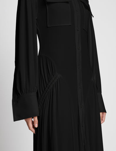 Detail image of model wearing Pleated Matte Jersey Shirt Dress in BLACK